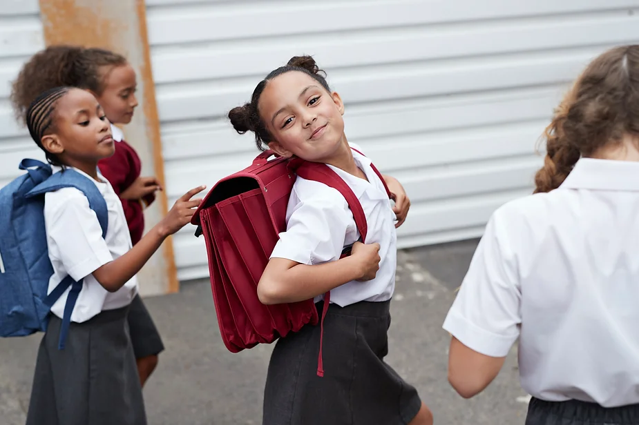 Kids at school smiling.