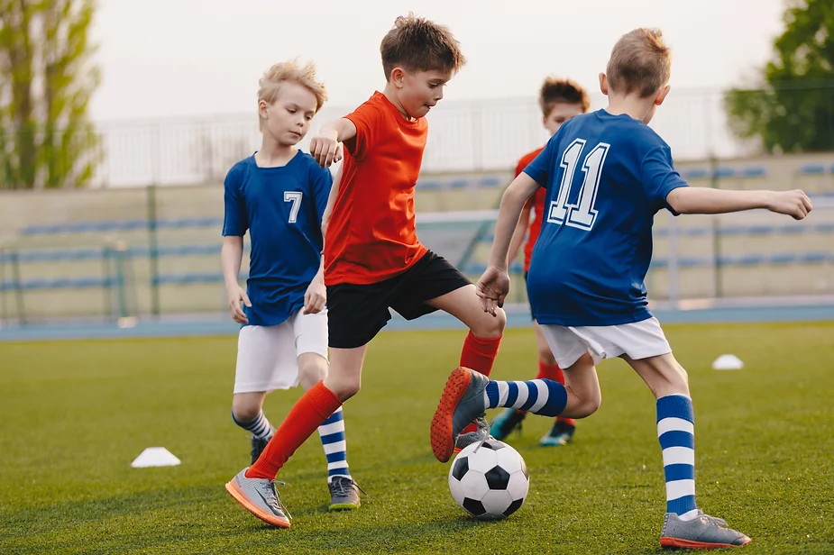 Boys playing soccer, and activity to help calm after school meltdowns.