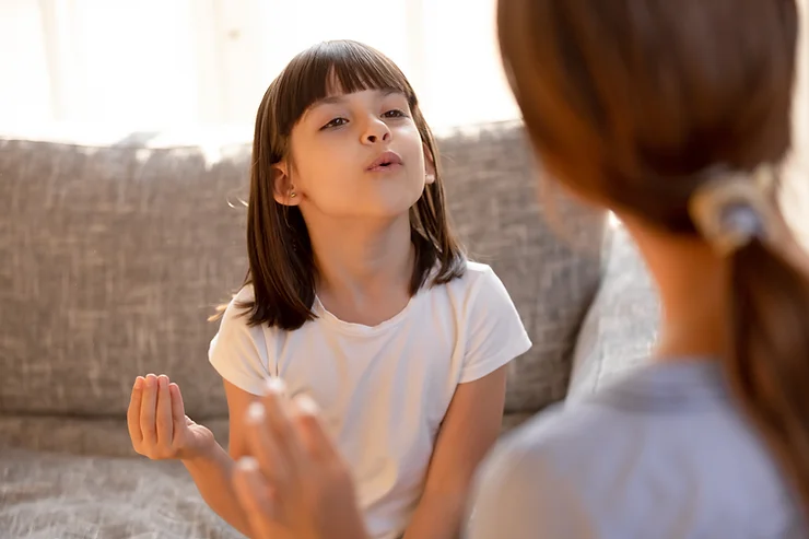 Autistic child receiving early intervention speech therapy.