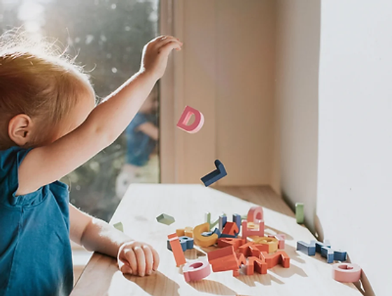 Happy autistic child receiving early intervention therapies.