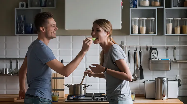 Parents on an exciting and romantic date cooking together