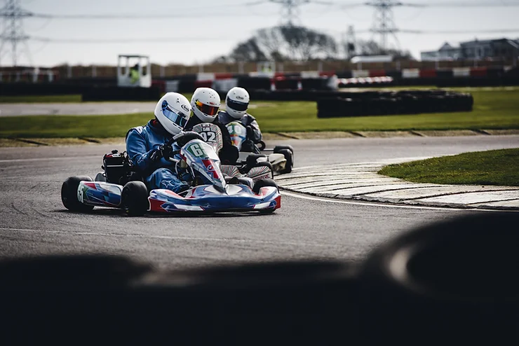 Parents on an exciting and romantic go-cart racing date