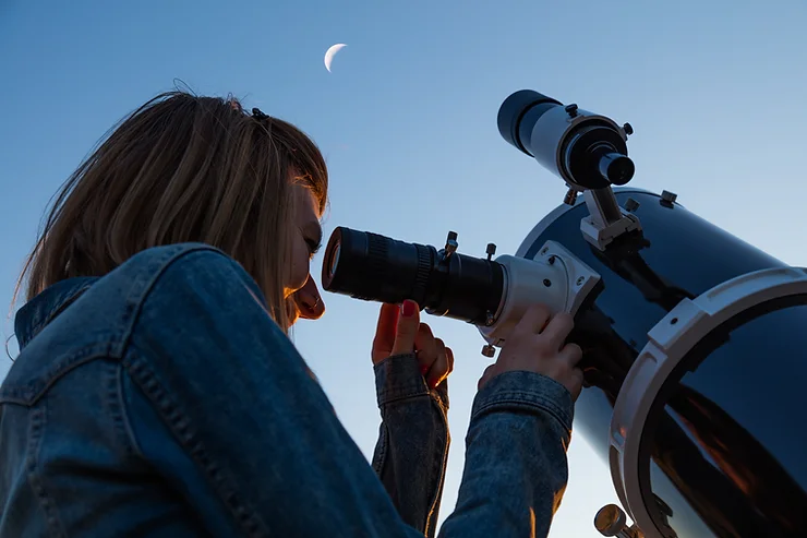 Parents enjoying an exciting date night stargazing at home