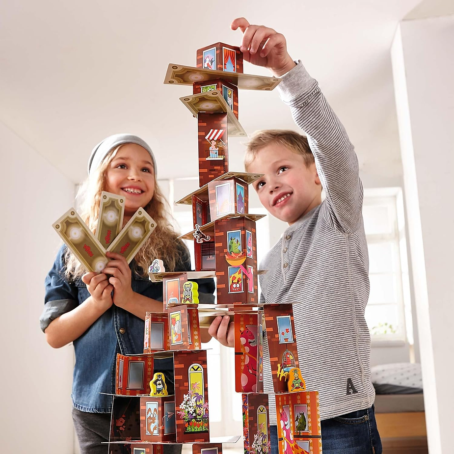 Kids playing Rhino Hero, one of the best games for family game night.