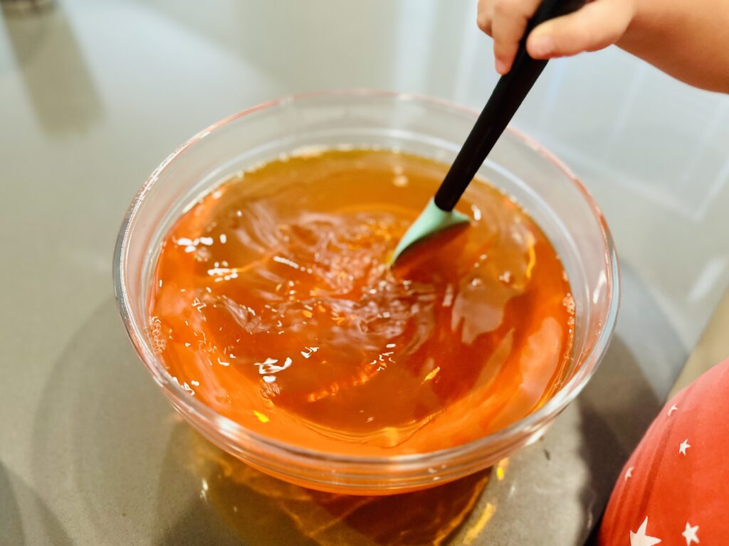 Little Girl mixing Jello.