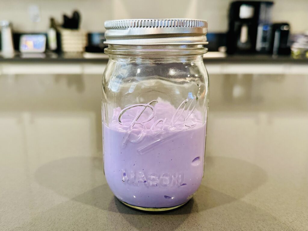 Homemade slime stored in a mason jar.