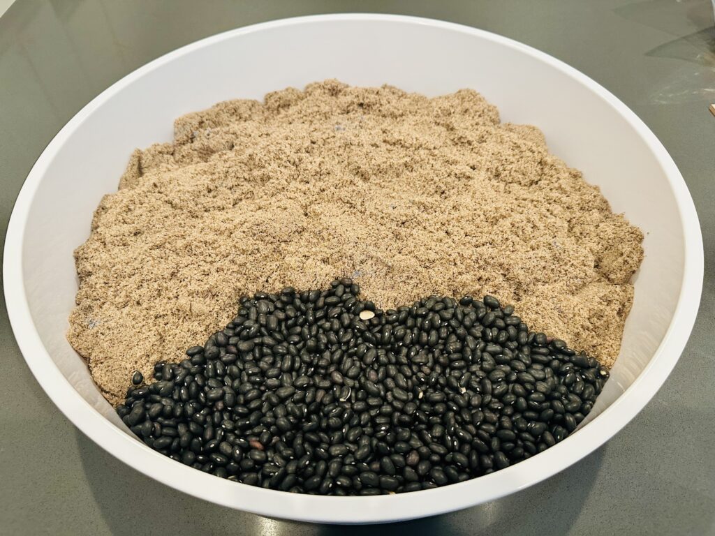 Kinetic sand and dried black bean sensory bin base